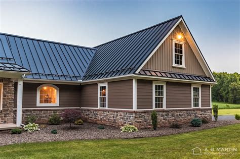 dark grey house with black metal roof|gray homes with black roofs.